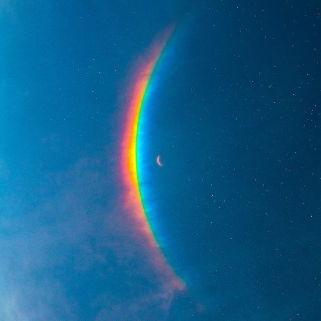 コールドプレイ『Moon Music』アルバムジャケット - 宇宙的なデザイン、惑星や星々が描かれている。